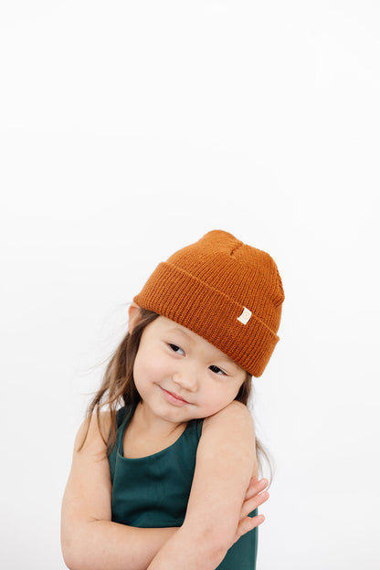 Young girl wearing Everyway kids activewear. Featuring Waffle Knit Beanie in Coffee.