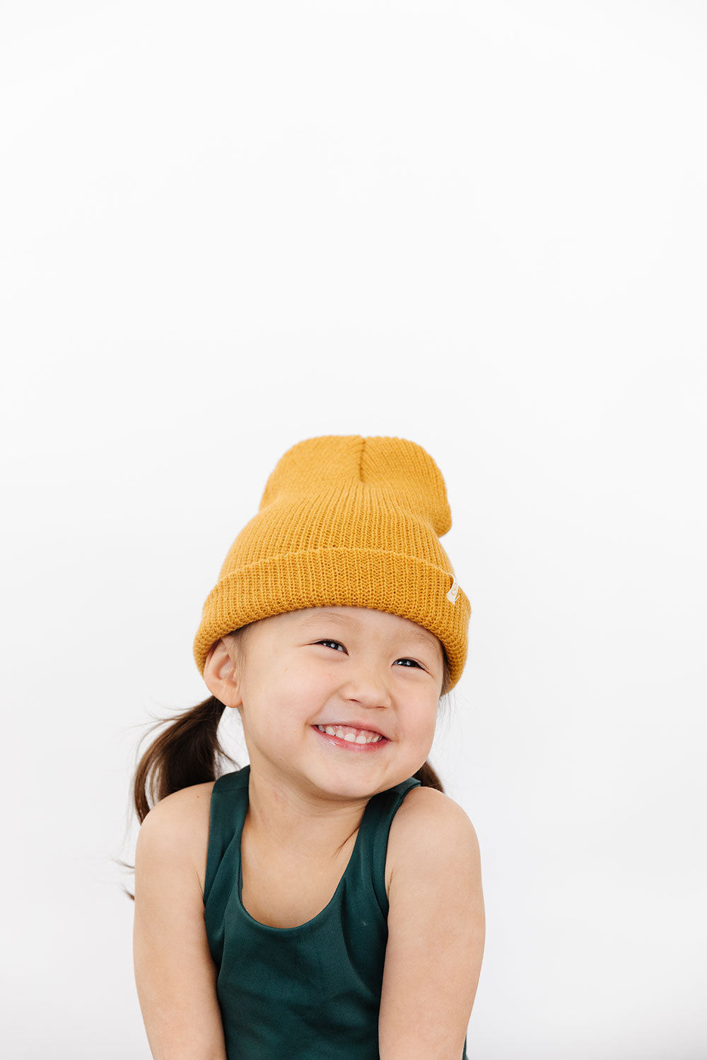 Young girl wearing Everyway kids activewear. Featuring Waffle Knit Beanie in Honey.